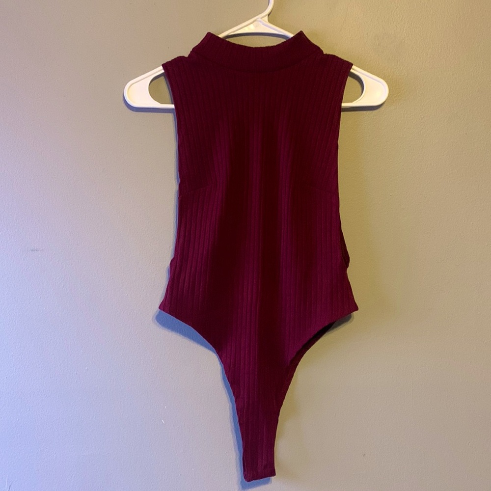 Deep red, size medium, forever 21 bodysuit. Never worn.